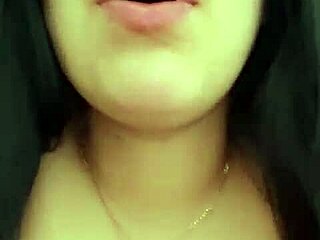 Latina woman chats with neighbor via video call and relaxes alone.