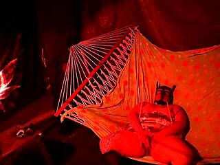 getting frisky in a tent, fingering her wet hole in a hammock