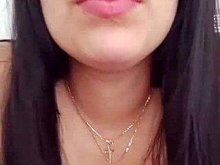 Latina woman chats with neighbor via video call and relaxes alone.