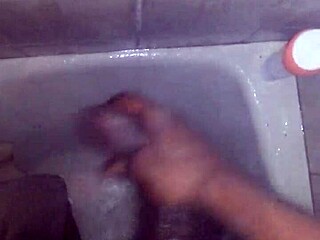 I jerk my big black monster cock in the shower and cum hard, but I slip and almost fall.