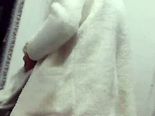 Husband steps out of shower in towel