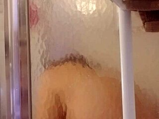 Shy milf takes a steamy shower and shaves her smooth skin