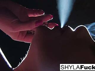 Shyla Stylez indulges in her smoking fetish, showing off her big tits in a solo scene.
