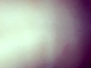 White woman shares intimate moments with black partner in brazilian setting.