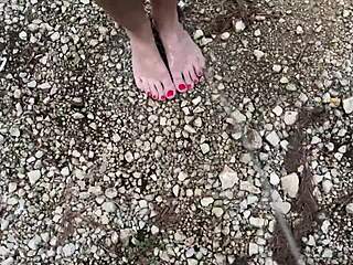 Great amateur pair of lovers engaging in foot play at the seashore