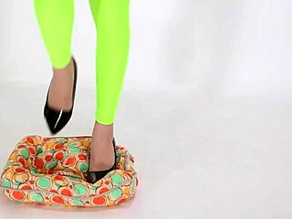 beautiful woman teases with high heels on cushion