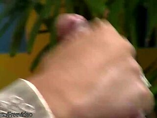 why is this dark haired shemale putting lotion on her big cock outdoors?