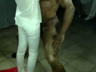 Muscular Dominican dancer's manner of striptease with blades