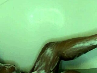 ebony wife enjoys a relaxing bath time massage with wet fingering
