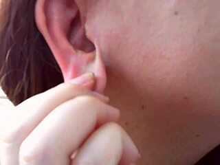 Nicoletta tries on earrings in her condominium garden for ear lovers