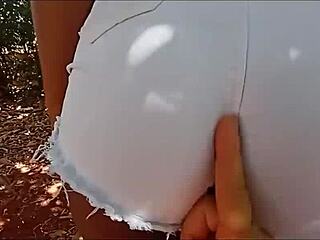 Cute teen granddaughter sitting on grandpa's lap in the farm?