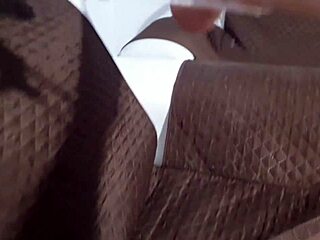 Latina pornstar masturbates on wet sofa, cum dripping down her leg