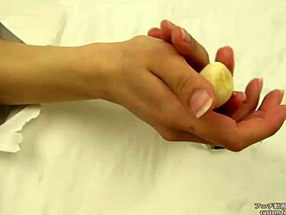 Asian Fetish Babe Crushes Banana with Hands in Messy Handjob Action