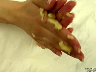 Asian Fetish Babe Crushes Banana with Hands in Messy Handjob Action