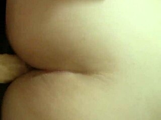 I fucked my wife doggy style with a dildo, making her orgasm hard.