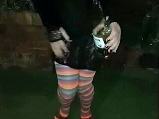 hey, check out this crossdresser with a small woman in the garden