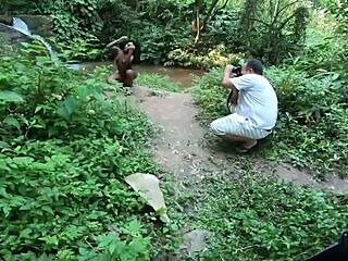 why is the young ebony girl posing in the stream?