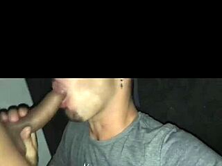 Young teen sucks older man in club bathroom, swallowing cum.