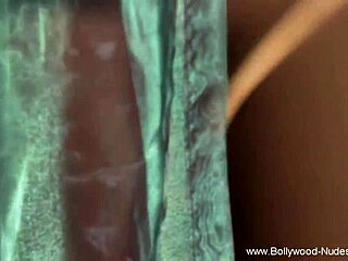 The beautiful indian woman performs a seductive dance to arouse her partner.