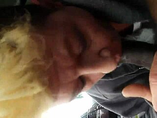 swallowing a black nut treat in intriguing way. it's all about the flavor and texture.