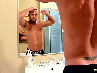 tattooed black jock strokes his swollen dong.