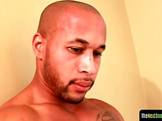 tattooed black jock strokes his swollen dong.