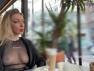 Public exposure in a cafe with transparent clothing and glass walls