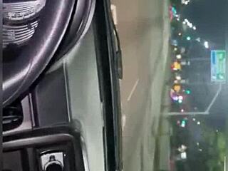 driving through traffic with a companion in the car