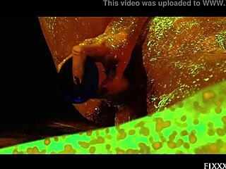 Glow in the Dark Goddess Masturbates with Dildo