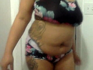 Big tit ebony milf shakes ass dancing in bathroom.