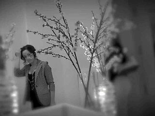 The mature lesbian in black stockings grabbed her partner's hair while getting her pussy licked