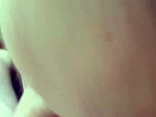 Gay man receives detailed blowjob from partner in intimate scene