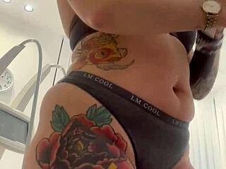 A blonde beauty strips and then wears a dress again in a rather seductive manner