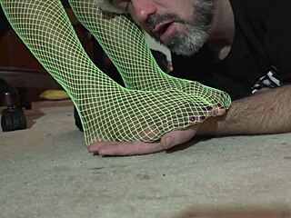 ebony amateur worships green fishnets in interracial domination scene