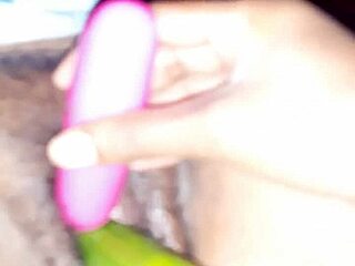 Indian wife in oiled scene with cucumber