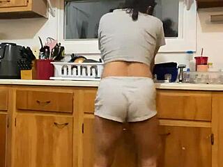 Anna Maria continues to dance and tease while washing dishes