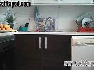 A couple enjoys passionate sex in their kitchen