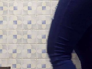 mature latina ann shakes her ass in leggings and fishnets during hidden camera bathroom worship.