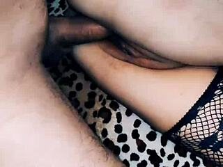 Beautiful wife in fishnet stockings shows off close-up