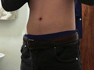 I strip half-naked to jerk off in the work bathroom with a huge cumshot.