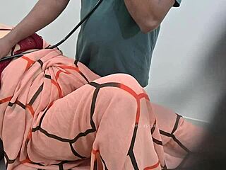 indian doctor examines a lady patient closely in the clinic setting. a routine check turns detailed.