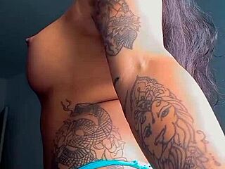 tattooed hooker showing off her skills for the crowd.