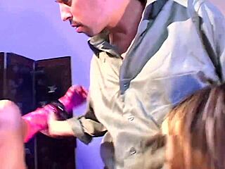 Hey, watch two blondes dive into a wild foursome with latex-clad BDSM guys!