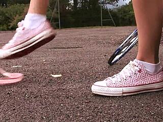 Claudia Rossi intensely masturbates with dildo in tennis uniform.