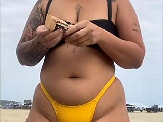 yo, check this tight yellow bikini splitting my pussy at the beach! 🏖️