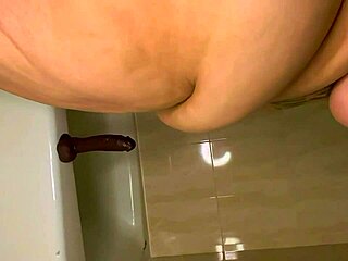 Jaidyn Venus dominates with a dildo in a steamy bathtub pool session.