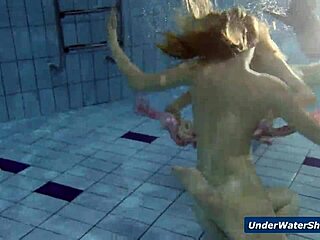 horny girls strip each other in the pool, getting wild underwater