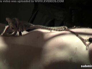 The struggling whore is suspended and humiliated.