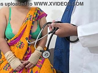 The doctor is checking the telugu aunty's boobs in the hospital with the nurse watching this indian patient scene.