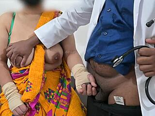 The doctor is checking the telugu aunty's boobs in the hospital with the nurse watching this indian patient scene.